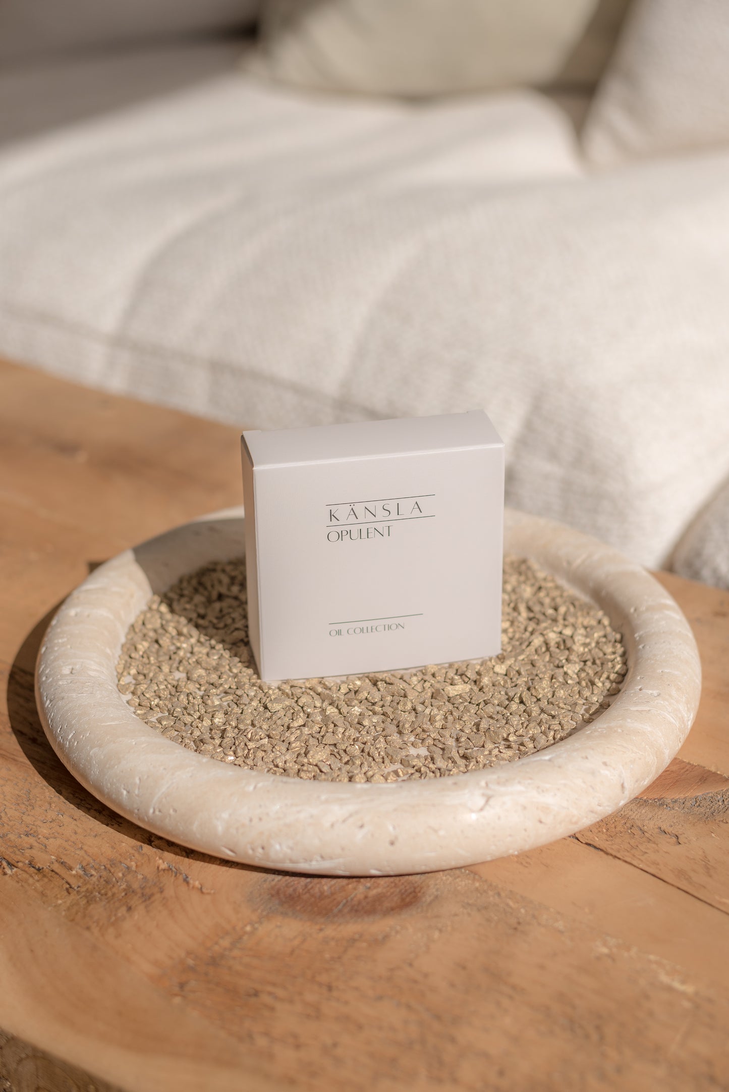 the oil collection box placed on top of a travertine display tray