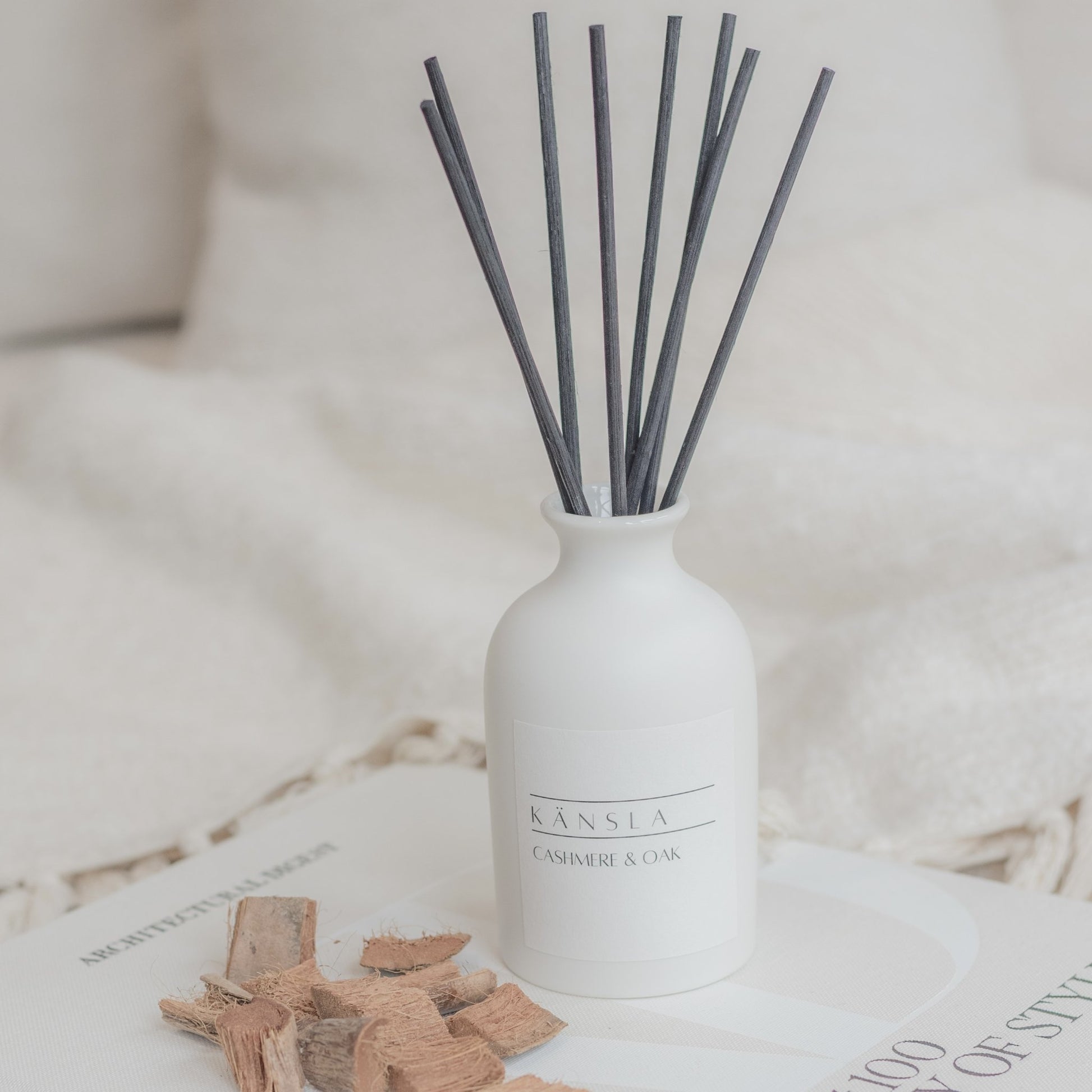 White ceramic reed diffuser with black rattan reeds cashmere and oak