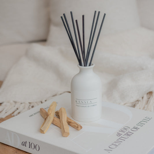 White ceramic reed diffuser with black reeds palo santo and cypress